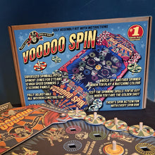 Load image into Gallery viewer, Voodoo Spin game set with packaging on a dark background by Vince Ray and Deejay Wheelie Bag.