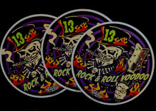 Load image into Gallery viewer, Three 'Rock &amp; Roll Voodoo' stickers with a skull and flames design on a black background.