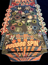 Load image into Gallery viewer, Vince Ray&#39;s Rock &amp; Roll Voodoo Spin machine with colorful design and text on a black background