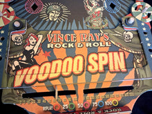 Load image into Gallery viewer, Voodoo Spin game set with packaging on a dark background by Vince Ray and Deejay Wheelie Bag.